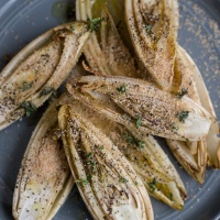 Roasted Endives with Thyme Olive Oil and Bread Crumbs