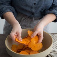 Tossing Sweet Potatoes with Sambal Oelek