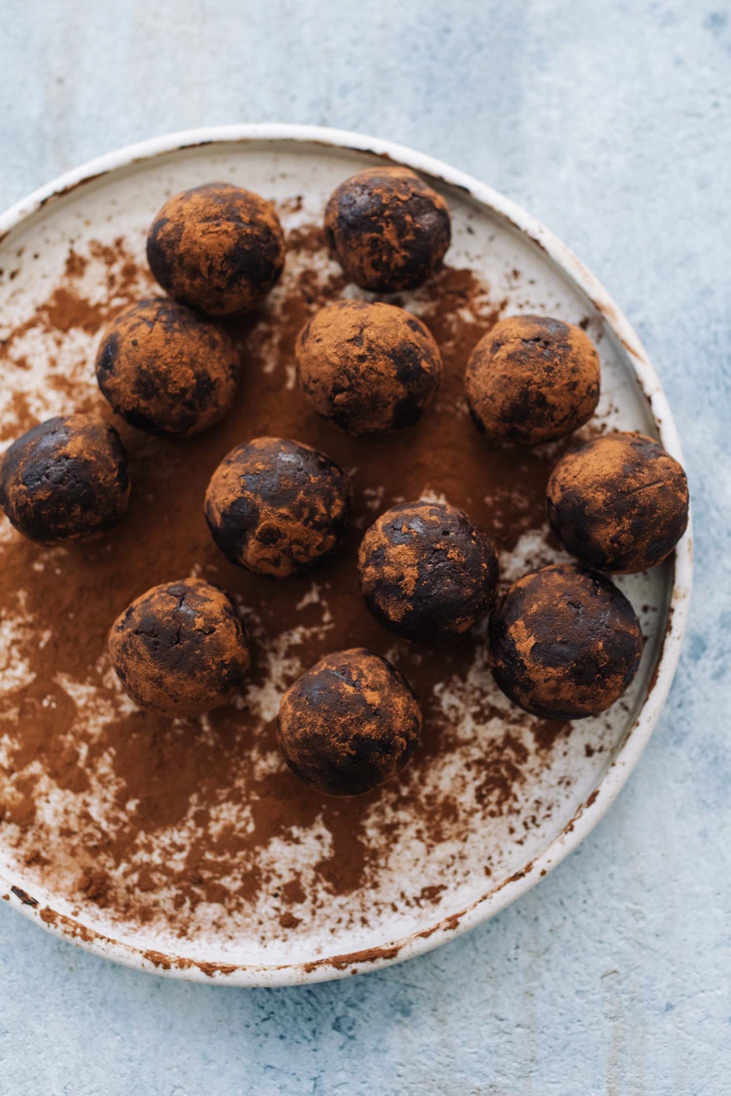 Overhead shot of Chocolate Peanut Butter bites dusted in cocoa powder
