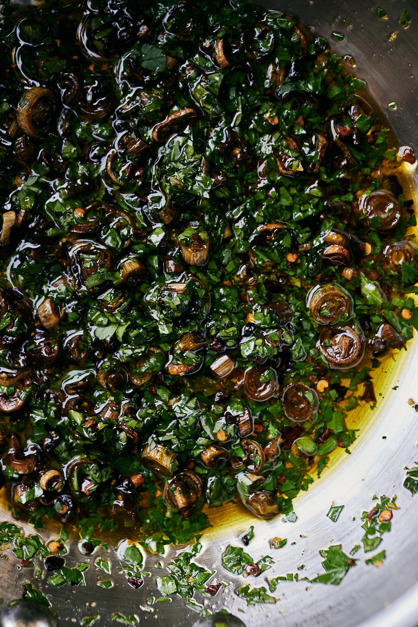 Close-up image of chili scallion oil with parsley