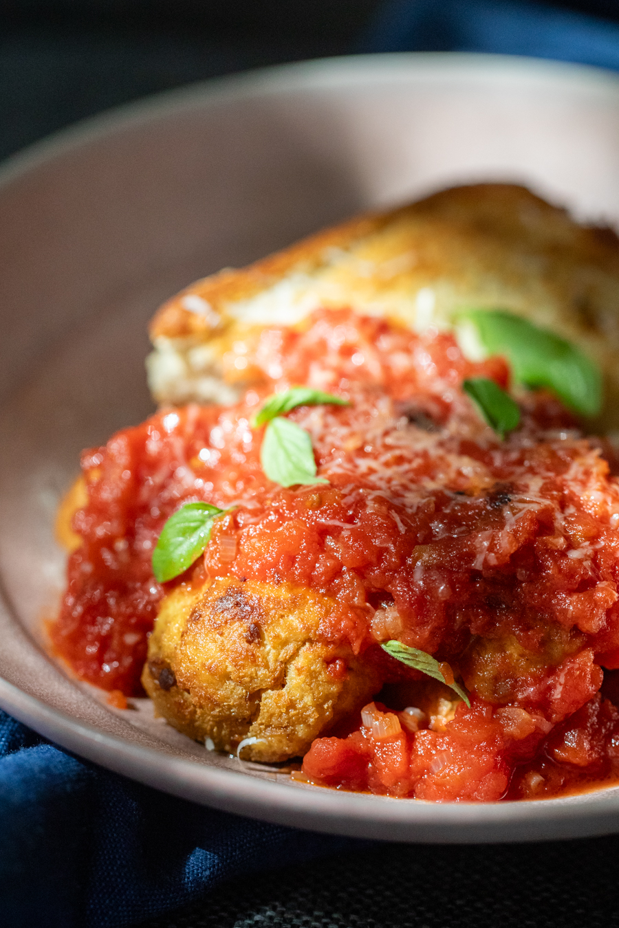 Tofu Meatballs covered in a tomato sauce.