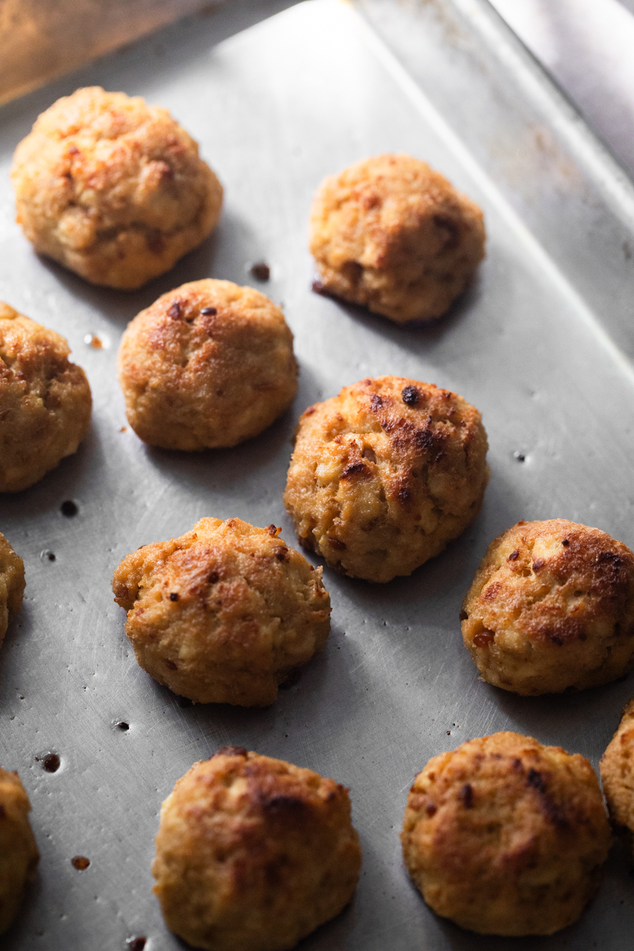 Tofu meatballs on a sheet pan.